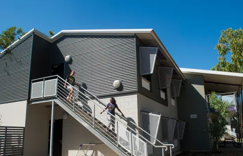 Residents walking down stairs at International House Darwin 