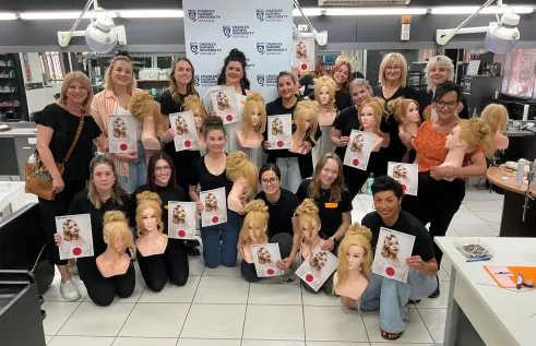 student pose with hair mannequin