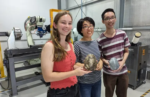 CDU student Jessie Duncan and PhD students Huifeng Wang and Cedric Tan. 