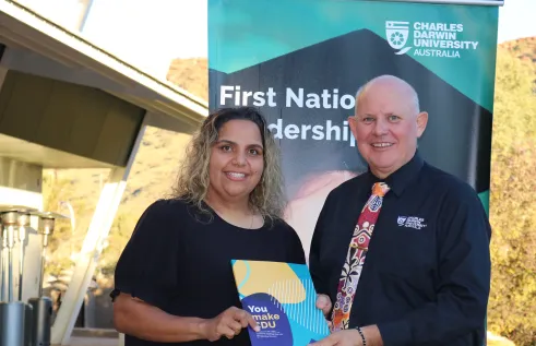 pre-education student receives certificate from Scott Bowman