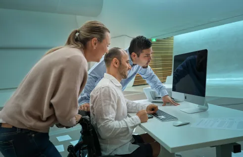Students looking at computer screen