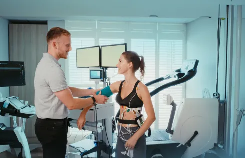 health professional monitoring female using medical equipment