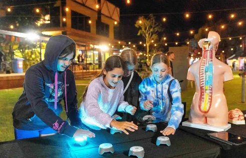 group of kids play light game
