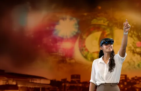 woman wearing VR goggles and pointing