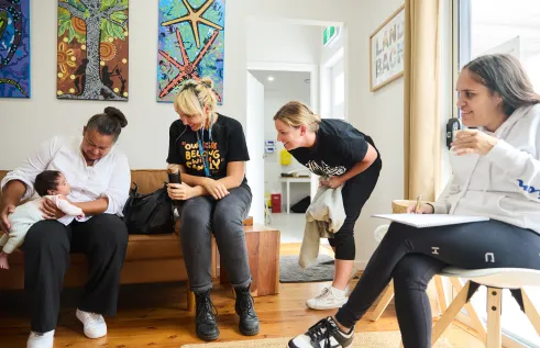 Waminda's Birthing on Country team and mum Nekaya dote on baby Akarii at the Minga Gudjaga Gunyah mother and baby clinic in Nowra NSW.  Picture: Tace Stevens 