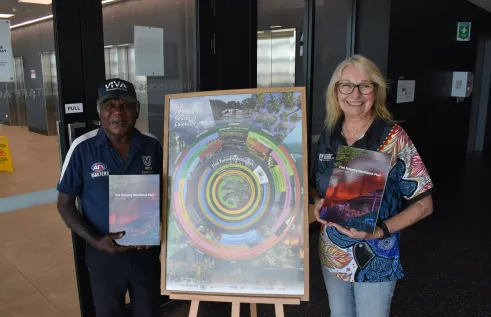 Tiwi Plantations Corporation Chair Gibson Farmer Illortaminni and CDU Northern Institute Research Associate Alicia Boyle with the Tiwi Forestry Workforce Plan 2026–2030.