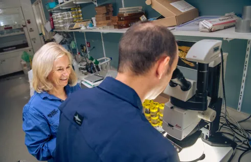Two people are working in a lab