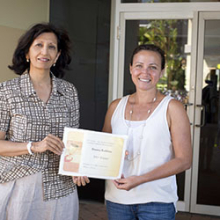 CDU Library Research Services Coordinator Jayshree Mamtora (left) presents the scholarship to Donna Robbins