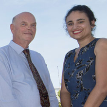DVC Research and Research Training Professor Lawrence Cram celebrates with Minister for Environment and Natural Resources Ms Lauren Moss