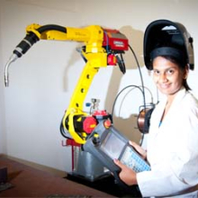 Senior technical officer Hemangi Surti controls the welding robot at NACOG