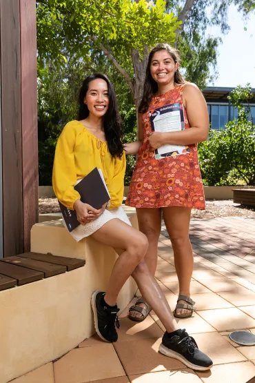 Two female international students smiling