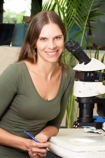 Dr Stefanie Oberprieler with microscope