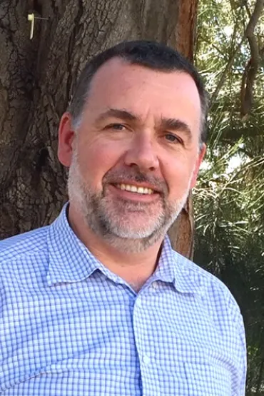 Ben Sparrow, head and shoulders with green leafy background