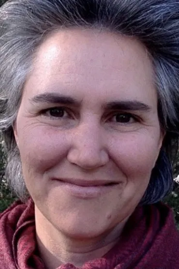 Taegan Calnan face with leafy vegetation in background