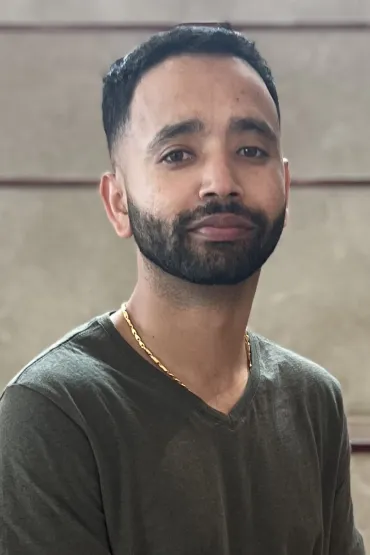 Male with dark green shirt