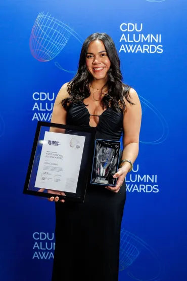 Jorja poses with her trophy and certificate.