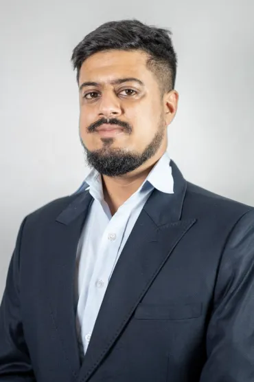 Man wearing suit smiling at camera