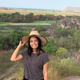 CDU student Srijana Ghimire standing against a backdrop of a national park in the Northern Territory