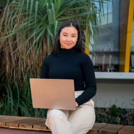 Student sitting with laptop